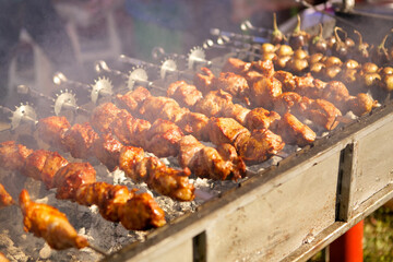 Close-up of the process of cooking meat on barbecue skewers. The concept of delicious and healthy food prepared in the open air event holiday with the whole family