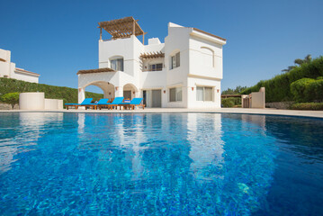 Swimming pool at a luxury tropical holiday villa resort