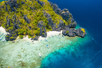 Shimizu Island, El Nido, Palawan, Philippines. Beautiful aerial view of tropical island, sandy beach, coral reef and sharp limestone cliffs