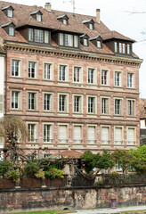 Fototapeta na wymiar Windows of old houses in center of Strasbourg