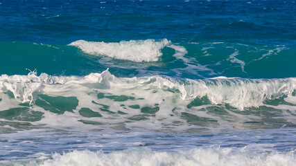 closeup emerald sea waves near a coast