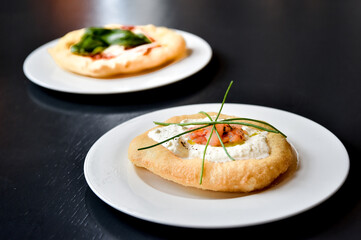 pizza fritta or fried pizza typical of the Campania region in southern Italy with salmon and burrata cheese