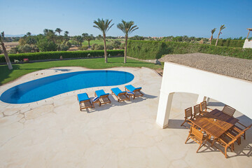 Swimming pool at at luxury tropical holiday villa resort