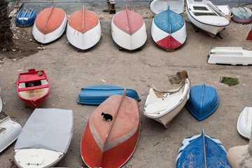 Boat in pavement ground parking by the shore