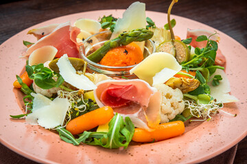 Fresh salad from vegetables, cheese and ham