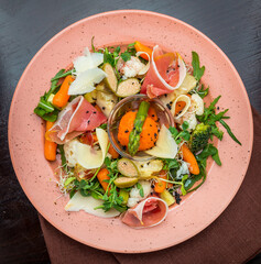 Fresh salad from vegetables, cheese and ham