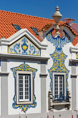 Obraz premium ancient aristocratic villa with facades decorated with yellow and blue azulejos in Cascais, Portugal