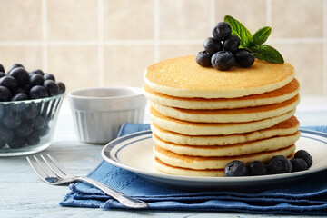 closeup of blueberry pancakes with a fork