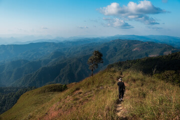 the man walking along way on the top of Monk Lui Luang, Doi Thule, Tak province, Thailand, 1350 msl