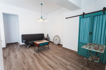 Naklejka na ściany i meble Living room inside a modern style rental house.
