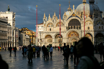 horizontal photo of crowds of tourists walking on Piazza San Marco in Venice