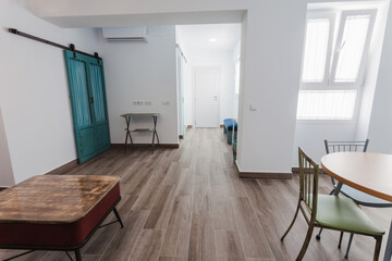 Living room and kitchen inside a modern style rental house.