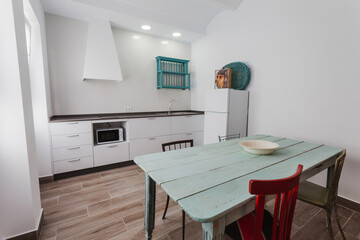 Kitchen inside a modern style rental house.