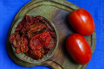 Dried tomatoes in a basket.