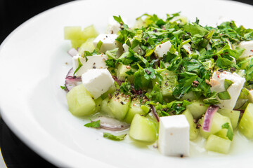 Salad with feta cheese, peppermint and cucumbers