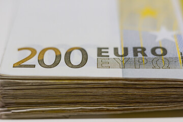 A pile of 200 (twohundred) Euro banknotes.