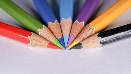 colored pencils on a wooden table