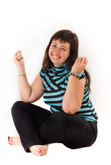 Plus size woman practicing yoga, Lotus position, smiling, looking at the camera, on a white background.