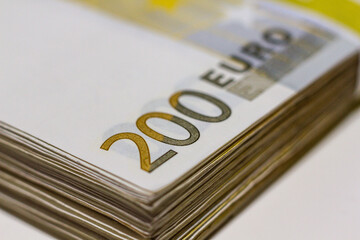 A pile of 200 (twohundred) Euro banknotes.