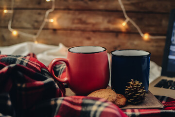 Flat lay winter and autumn cozy vintage background with copy space. The cup of tea or coffee on wooden background. Christmas atmosphere.