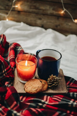 Flat lay winter and autumn cozy vintage background with copy space. The cup of tea or coffee on wooden background. Christmas atmosphere.