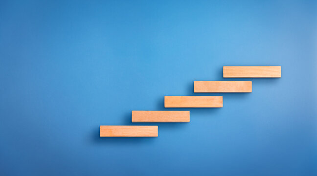 wooden block success steps. Concept of business growth and success. Success steps concept