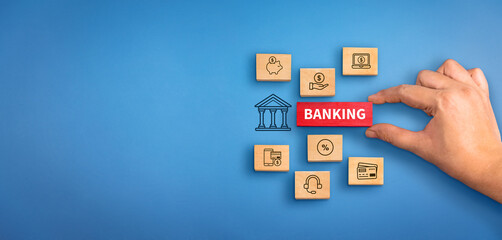 hand holding a wooden block with text Banking with banking services icons. Banking concept, Banking background.