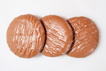 Chocolate Protein bars filled with chocolate sauce, cut on a white background