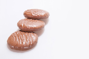 Chocolate Protein bars filled with chocolate sauce, cut on a white background