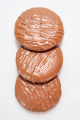 Chocolate Protein bars filled with chocolate sauce, cut on a white background