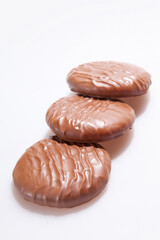 Chocolate Protein bars filled with chocolate sauce, cut on a white background