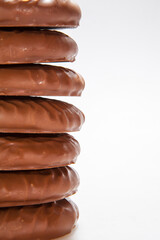 Chocolate Protein bar filled with chocolate sauce, cut on a white background