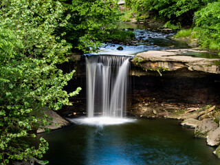 A beautiful creamy, milky waterfall with the motion frozen, nestled into a park in New Castle, Pennsylvania.  Beauty in nature, landscape photography.