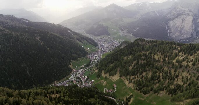Aerial of Selva Val Gardena in South Tyrol. Tourism Village in the Dolomites 4K