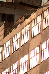 Large windows of a tall building in sunset