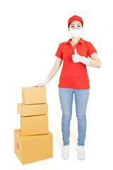 Delivery woman in red uniform isolated on white background.Courier in protective mask and medical gloves holding cardboard box. Receiving package under quarantine, disease outbreak