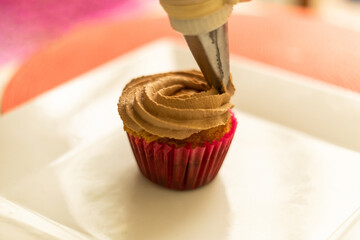 decorating cupcake in the table