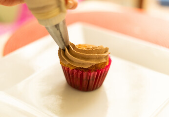 decorating cupcake in the table