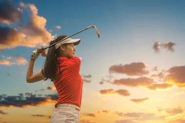 Foto auf Acrylglas Female golf player playing golf in professional golf course. © Kris Tan