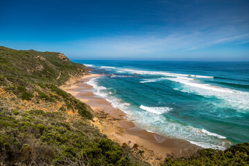 Traveling along the Great Ocean Road in New South Wales, Australia, visiting  a beach next to the Seven Miles Beach National Park at a sunny day in summer.