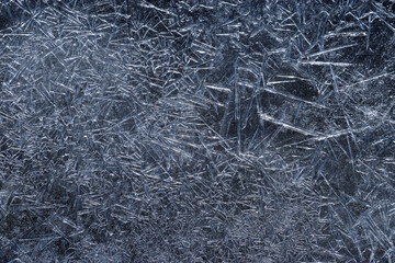 Ice texture. Dark frozen water for winter abstract background. Closeup
