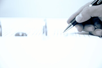 hand with pen, man working on document