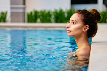 Swimming pool spa retreat relaxation. Relaxing woman enjoying serenity in summer holiday travel vacation at resort hotel.