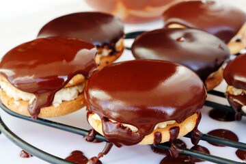 Chocolate sandwich cookies on wire rack