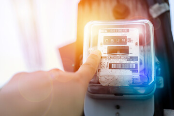 Hand is touching the transformer with copy space