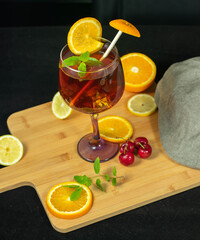 cold drink on wooden table surrounded by fruit