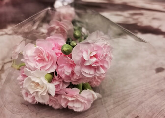 pink flower bouquet on wooden background