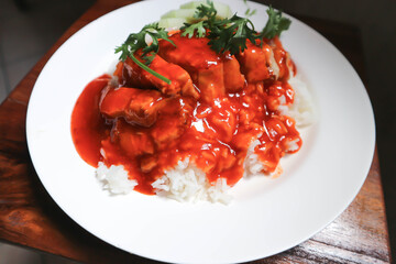 rice topped with pork, pork and rice
