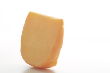 Hard Dutch gouda cheese on white