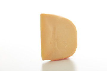Hard Dutch gouda cheese on white